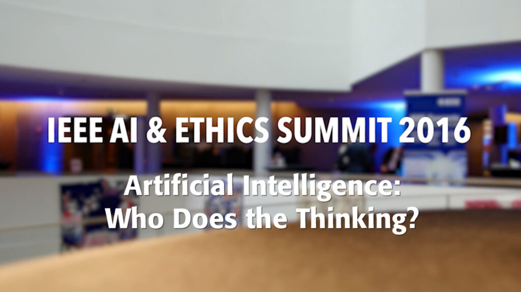 IEEE AI & ETHICS SUMMIT 2016 - Artificial Intelligence - Who Does the Thinking? White text against background of a conference expo area.