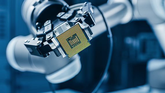 Industrial robotic manipulator end effector holding CPU chip